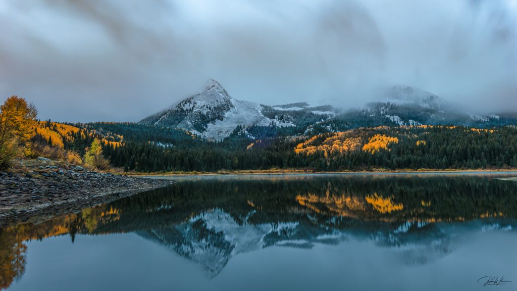 Lost Lake landscape in Colorado with still water reflecting mountain scenery